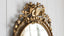 Antique Oval Gilt Mirror with Musical and Floral Fine Details